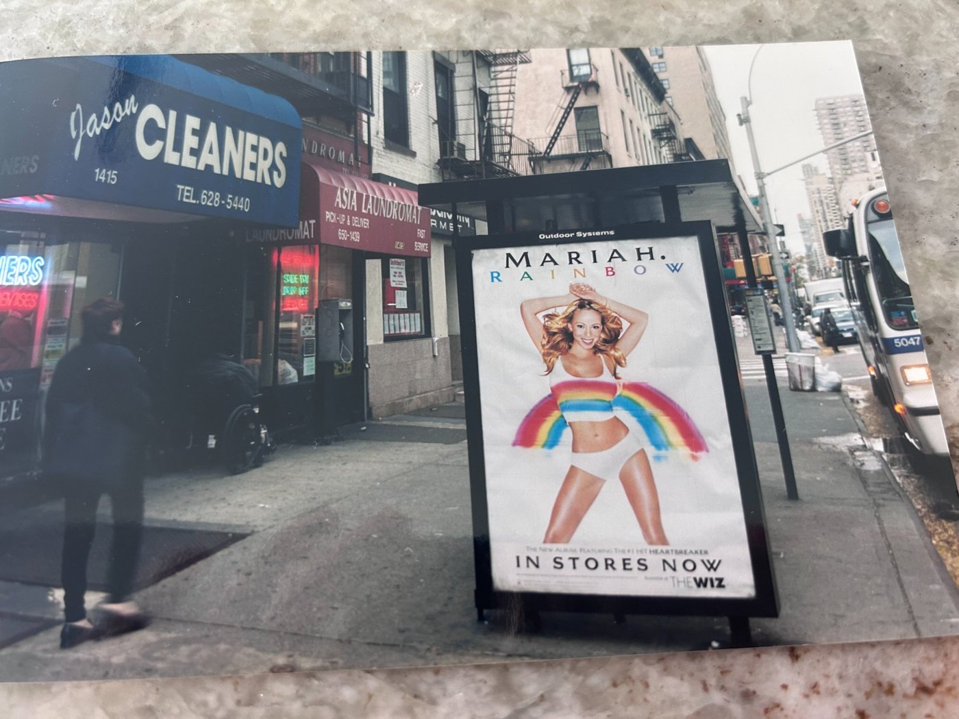 Mary's first outdoor buy — a Manhattan bus shelter ad for Mariah Carey's Rainbow album, fall 1999, on an Outdoor Systems shelter.